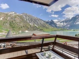 a view from the balcony of a resort with mountains at Studio Palafour - Le Lac-2 by Interhome in Tignes