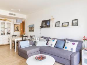 a living room with a couch and a table at Apartment Parque Central by Interhome in Estepona