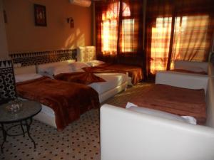 Letto o letti in una camera di Riad Passiflora