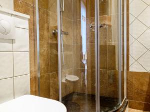 a shower with a glass door in a bathroom at Apartment Altitude 2100 by Interhome in Tignes