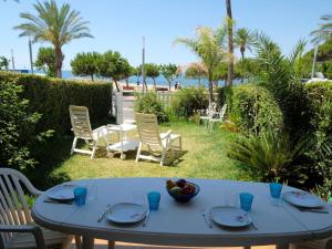 a white table with a bowl of fruit on it at Apartment Costa Blanca II by Interhome in Cambrils