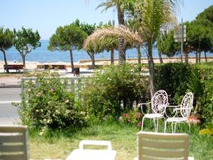 a group of chairs sitting next to the beach at Apartment Costa Blanca II by Interhome in Cambrils +20 photos