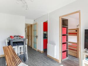 a room with a room with doors and shelves at Apartment Pegase Phenix-67 by Interhome in Le Corbier