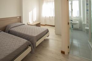 A bed or beds in a room at Resort Orizzonti