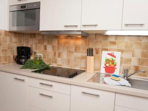 a kitchen with a sink and a counter top at Apartment Wohnung 4 - Am Sonneneck by Interhome in Ruhpolding