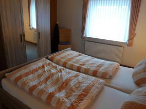 Ένα ή περισσότερα κρεβάτια σε δωμάτιο στο Apartment Silbermöwe by Interhome