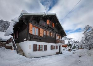 a house on a ski lift in the snow at Chalet Fauvette in Morzine