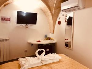 A television and/or entertainment centre at Mastropaolo42 Luxury B&B