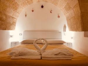 A bed or beds in a room at Mastropaolo42 Luxury B&B