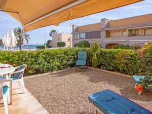 A garden outside Apartment Golf Sant Jordi by Interhome