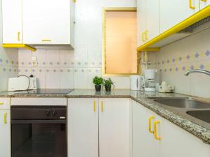 A kitchen or kitchenette at Apartment Golf Sant Jordi by Interhome