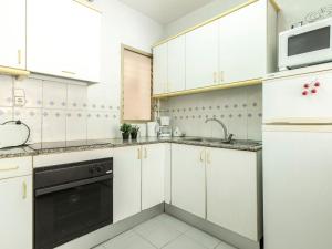 A kitchen or kitchenette at Apartment Golf Sant Jordi by Interhome