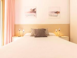 A bed or beds in a room at Apartment Golf Sant Jordi by Interhome