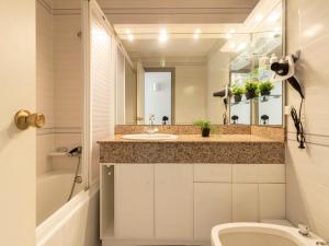 A bathroom at Apartment Golf Sant Jordi by Interhome