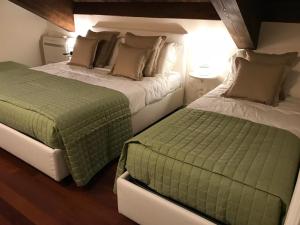 Ένα ή περισσότερα κρεβάτια σε δωμάτιο στο Principessa di Savoia