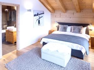 A bed or beds in a room at Chalet Chalet Astoria by Interhome