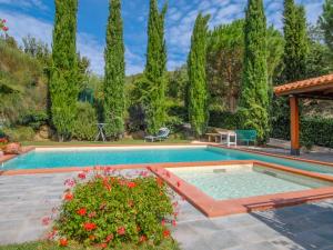 a swimming pool in a yard with trees at Villa Messi by Interhome in Castello di Montalera