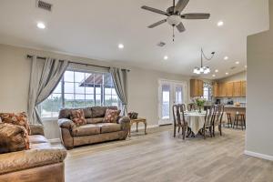 a living room with a couch and a table at Show Low Home with White Mountain Lake Access! in White Mountain Lakes Estates