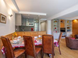 a kitchen and dining room with a table and chairs at Apartment Le Shamrock by Interhome in Tignes