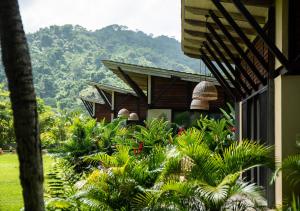 a resort with a mountain in the background at Gardenia Springs - La Finca Buritaca in Buritaca