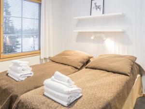 En eller flere senge i et værelse på Holiday Home Rukatonttu d 15 by Interhome + 19 billeder