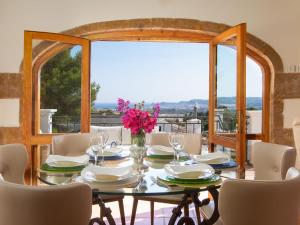 a dining room with a table and chairs at Villa Monte Feliz by Interhome in Jávea