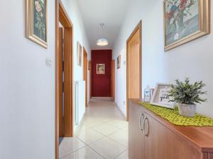 a hallway with a hallway leading into a room at Apartment Laura by Interhome in Galižana