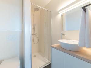 a bathroom with a sink and a shower at Apartment Seaview 4 by Interhome in Bredene