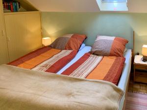 two beds sitting next to each other in a bedroom at Apartment Peters-2 by Interhome in Barkholt