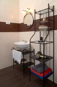 a bathroom with a sink and a mirror at Luxury Villa Bernarda in Malinska