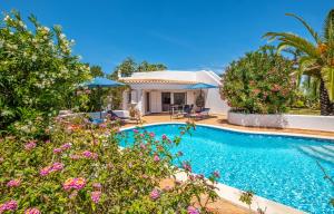 a swimming pool in front of a villa at Villa Sunshine by Algarve Vacation in Armação de Pêra +42 photos