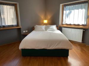 Voodi või voodid majutusasutuse Villa Dosso del Grillo toas