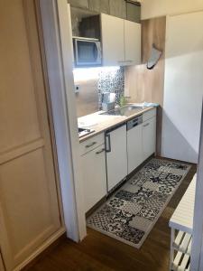 Kuchyň nebo kuchyňský kout v ubytování Apartment Goisernperle