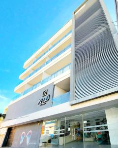 a building with a sign on the side of it at HOTEL NABU VALLEDUPAR in Valledupar