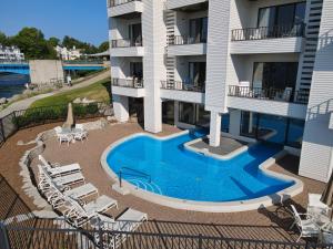 an aerial view of a building with a swimming pool at 119 Edgewater Inn in Charlevoix