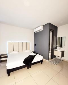 Voodi või voodid majutusasutuse HOTEL NABU VALLEDUPAR toas