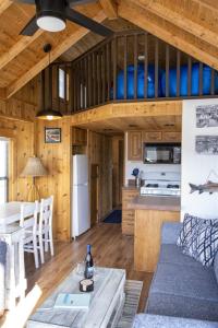 a kitchen and living room with a couch and a table at H - Harbor Watch in Fort Bragg
