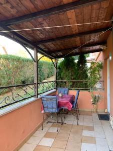 a patio with a table and chairs on a balcony at Sara in Višnjan