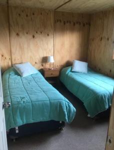 Postel nebo postele na pokoji v ubytování OmShanti