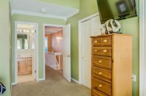 a bathroom with a television on top of a dresser at 4 A, Three Bedroom Townhome in Destin