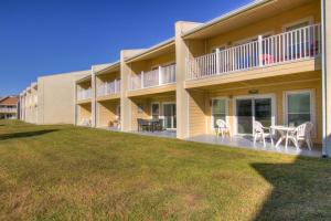 a large house with a lawn in front of it at 7F Nama-Stay in Destin