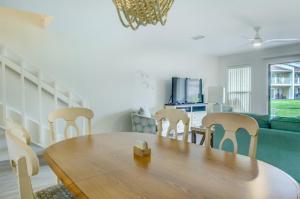 a dining room with a wooden table and chairs at 2 C, Three Bedroom Townhome in Destin