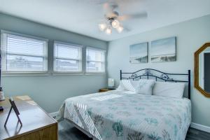a bedroom with a bed and a ceiling fan at 2 B, Three Bedroom Townhome in Destin