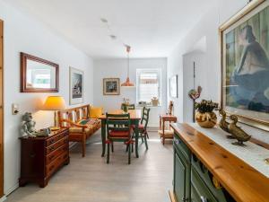 a living room with a table and chairs at Tranquil Pepelow Retreat in Pepelow