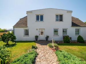 a white house with a gravel driveway at Tranquil Pepelow Retreat in Pepelow