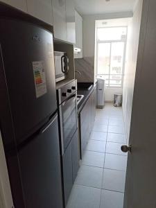 Кухня или мини-кухня в Departamento Nuevo en Condominio Viña del Mar
