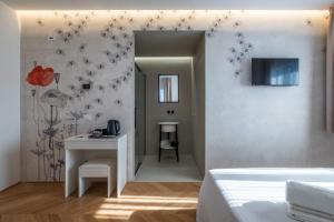 Televízia a/alebo spoločenská miestnosť v ubytovaní Le Makè bed & breakfast