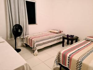 Postel nebo postele na pokoji v ubytování Excelente Duplex em Arembepe Aquaville - Bahia + 22 fotografií