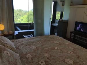 Letto o letti in una camera di 礁溪好好沐包棟溫泉Villa 龜山島景觀 客餐廳可開伙 KTV Netflix 禁菸 戶外平面停車