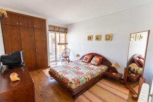 Giường trong phòng chung tại Casa do Suave Mar